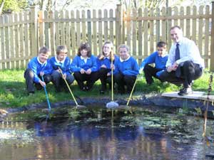 Milborne Port Primary School pupils enjoying their new pond